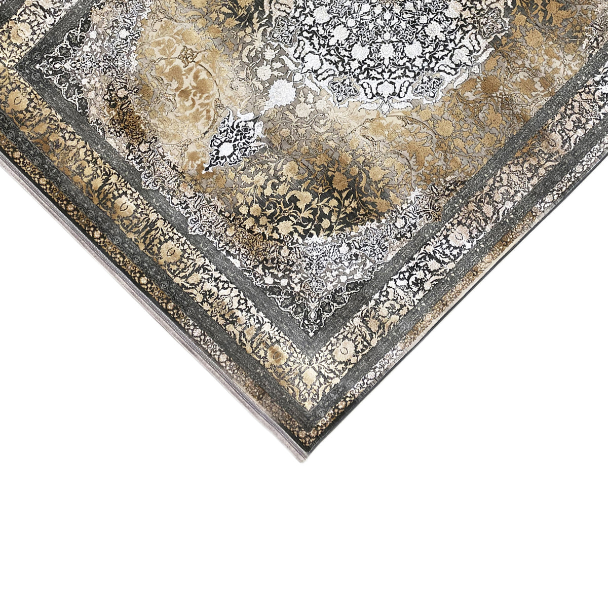 Rechteckiger Teppich ausgebreitet: kontrastreiches Ornamentmuster in Gold, Silber und Dunkelgrau.