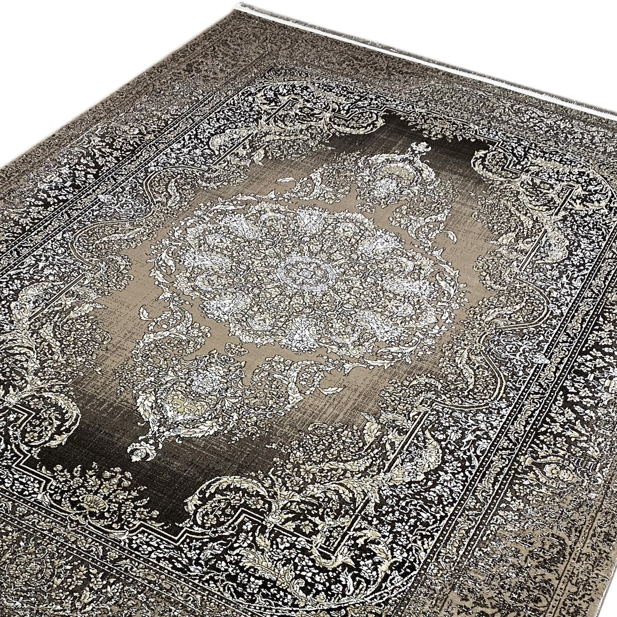 Teppichdetail: filigranes Ornamentmuster und Medaillon, silberfarben auf dunkelgrau