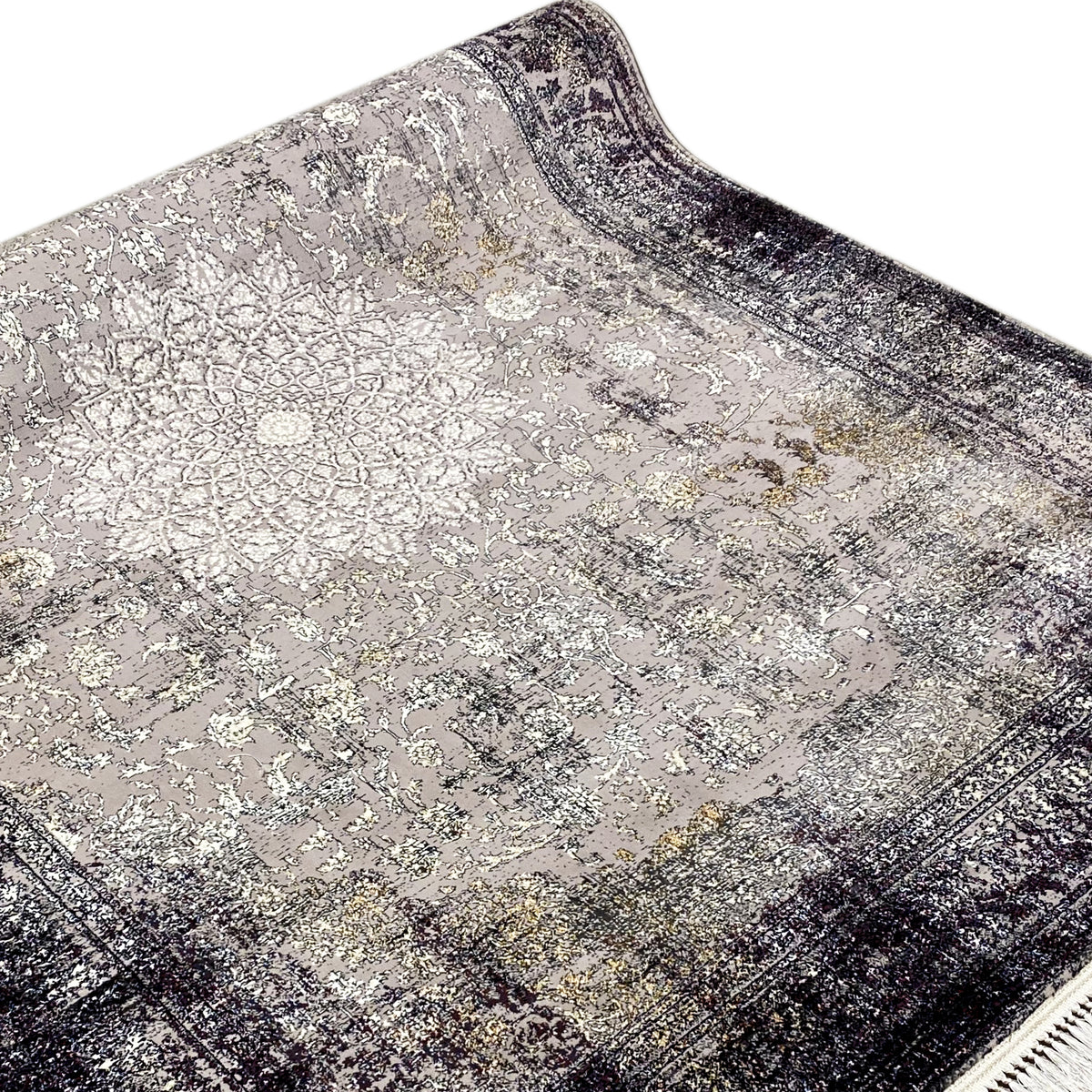Nahansicht: Vintage-Teppich mit Ornament-/Kachelmuster, grau-beiger Fläche, dunklem Rand, Fransen