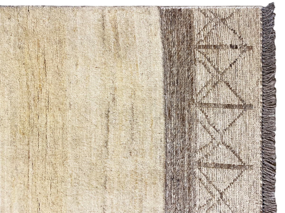 Gabbeh-Kelim-Teppich, Detail der Seitenbordüre mit geometrischem Muster und Fransen