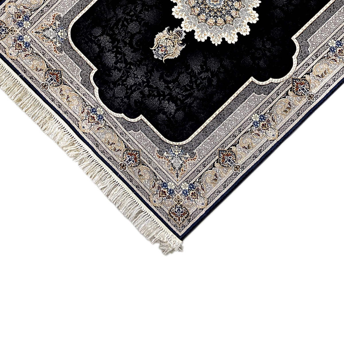 Nahansicht Ecke: schwarzer Teppich mit geprägtem Ornamentbordüre, creme, blau und Fransen