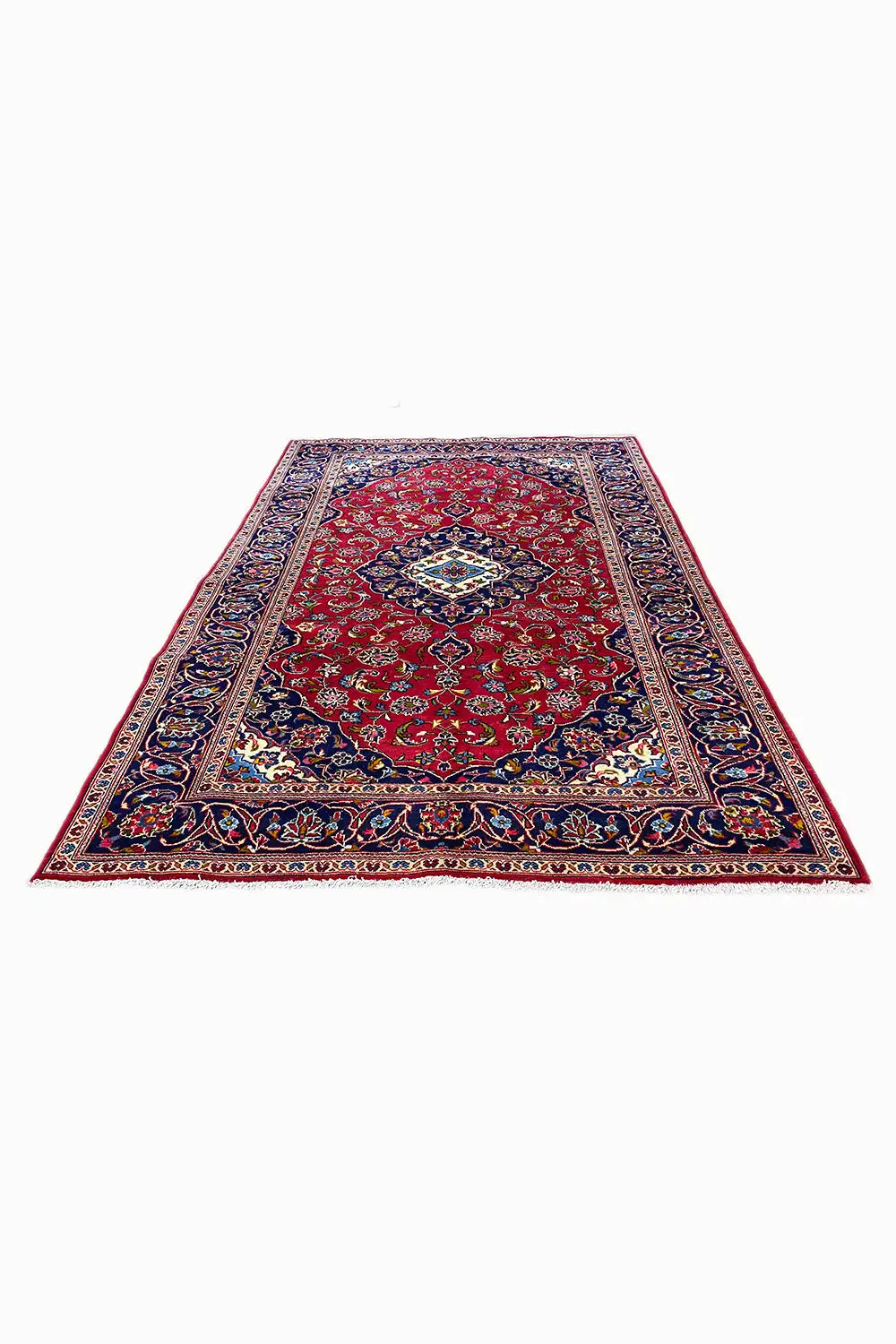 Teppich rechteckig mit rotem Grund, blauem Rand und mehrfarbigen Ornamenten