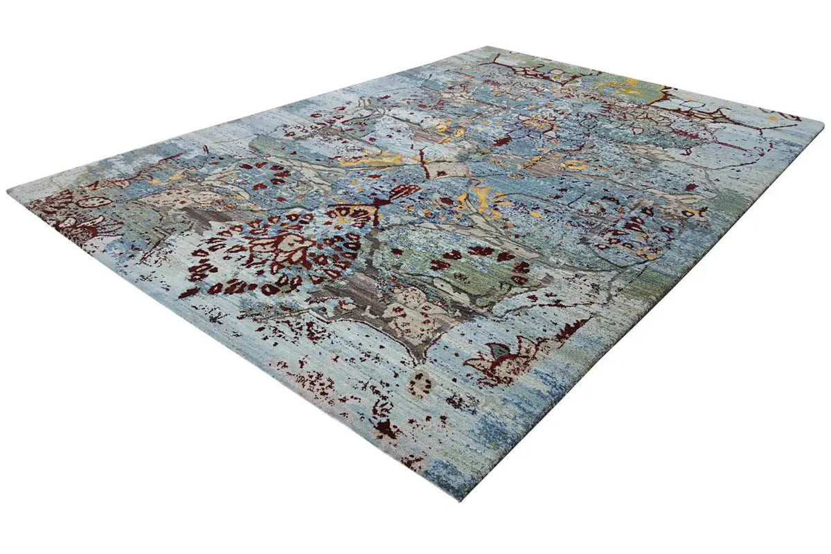 Gabbeh-Teppich Lori, diagonale Ansicht mit floralen Ornamenten in Blau, Rot und Gelb